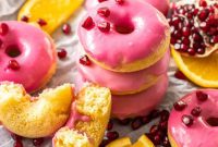 Vibrant Orange Donuts with Pomegranate Glaze