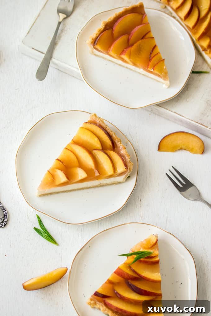 3 slices of Panna Cotta Fresh Peach Tart on white plates