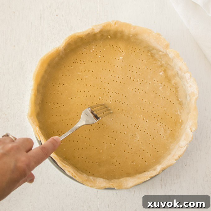 Docking tart dough with a fork