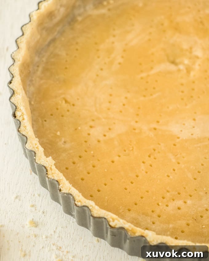 Closeup of a tart shell in a tart pan