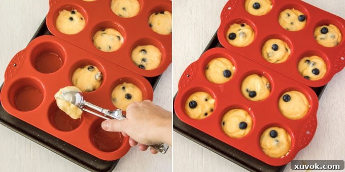 Muffin batter being portioned into a 12-hole muffin pan, showing the careful distribution of the mixture
