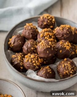 Chocolate truffles in a grey bowl.