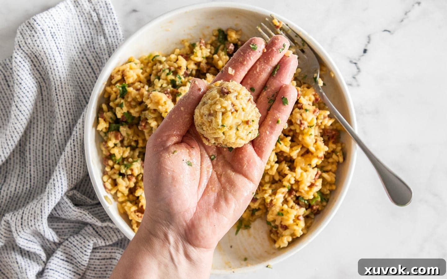 Risotto rolled into a smooth ball around mozzarella.
