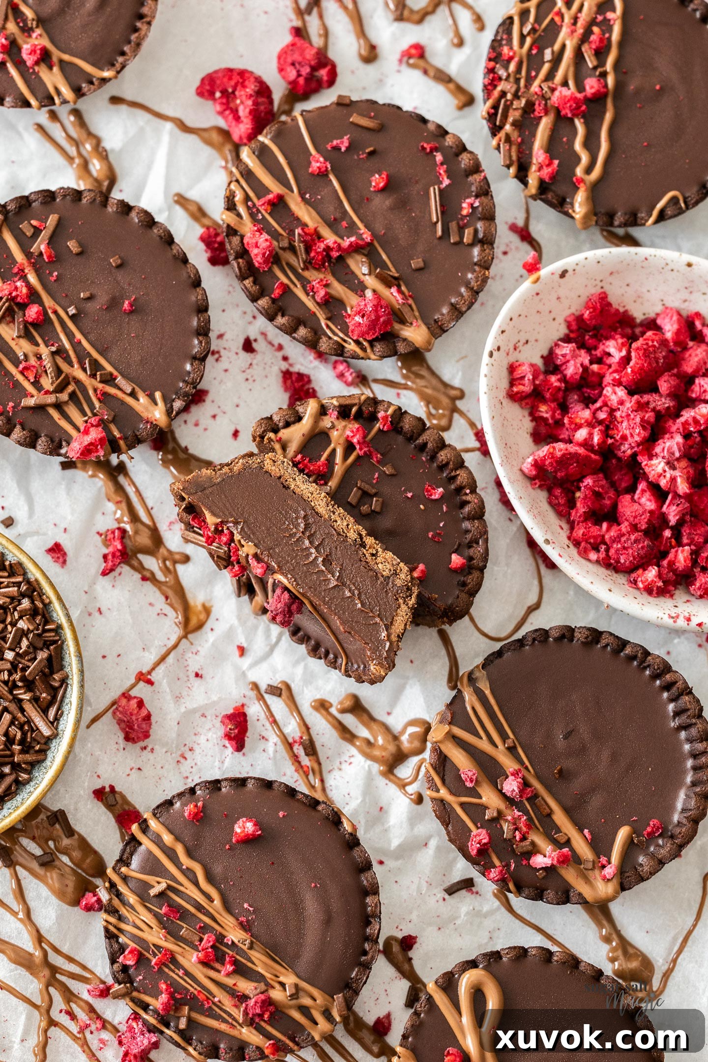 A chocolate tart sliced in half to show the inside texture.
