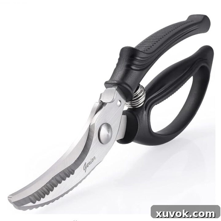 A close-up image of heavy-duty poultry shears.