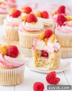 These Peach Melba Cupcakes are based on the classic Peach Melba dessert. Fabulous raspberry and peach cupcakes with a creamy vanilla frosting.