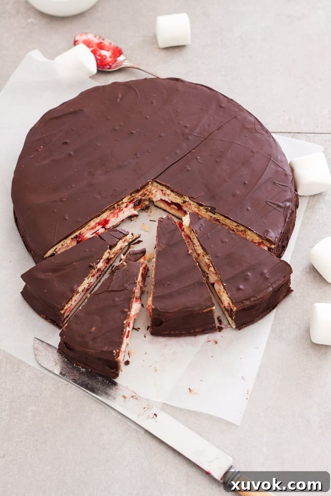 A giant wagon wheel on a sheet of baking paper, ready to be sliced.