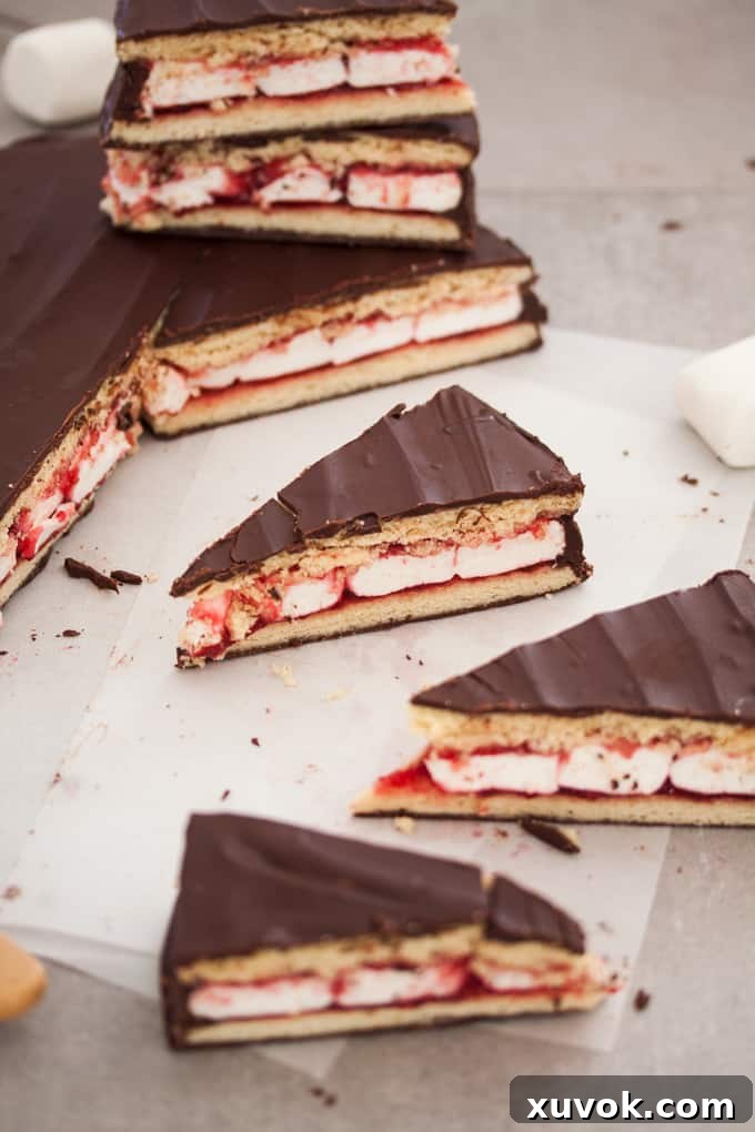 Slices of giant wagon wheel on baking paper, highlighting the rich chocolate coating.