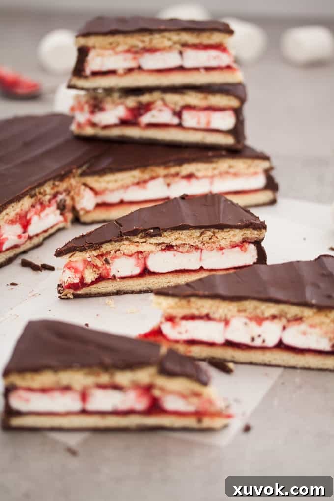 Slices of giant wagon wheel on baking paper with a stack in the background, showcasing its impressive size.