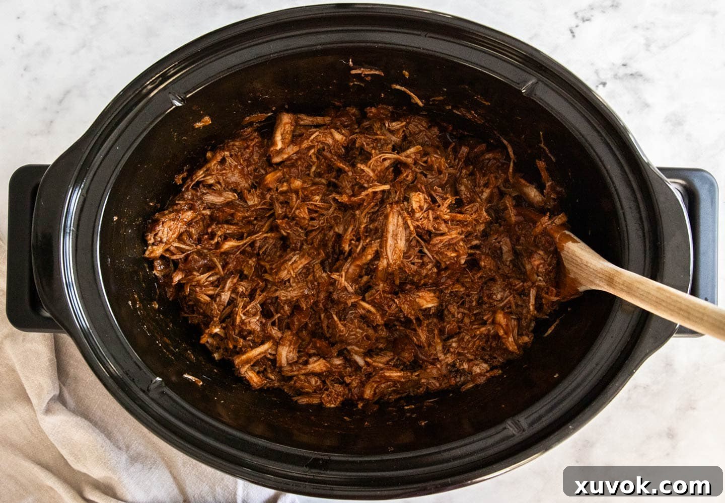 The shredded pork mixed with the sauce.