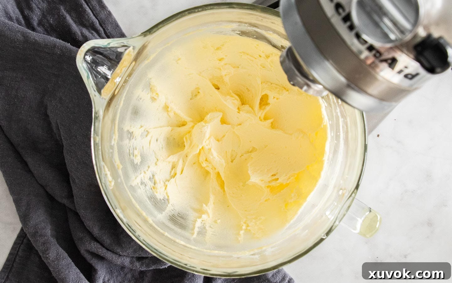 Softened butter and caster sugar creamed together in a mixer bowl.