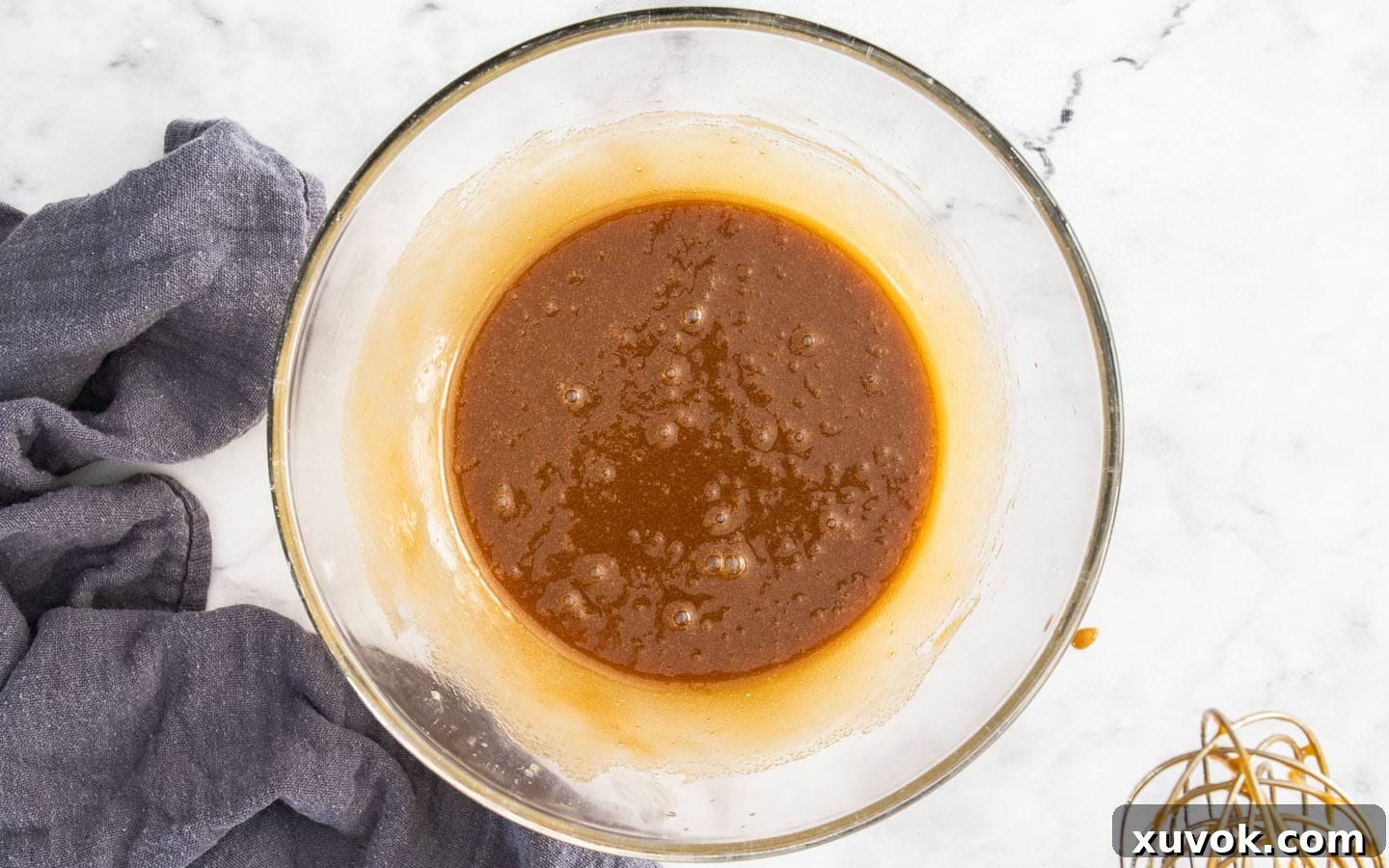 Melted butter, sugars, and eggs whisked together until smooth and creamy.
