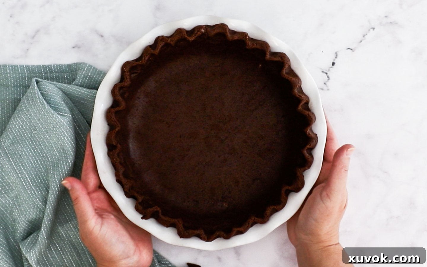 The chocolate pie dough, perfectly shaped and chilled in its pie dish, ready for blind baking.