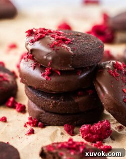 Closeup of a stack of 4 shortbread cookies.