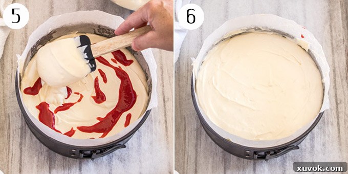 A visual demonstration of adding the second, perfectly smooth layer of creamy cheesecake filling directly over the initial layer, further building the dessert.