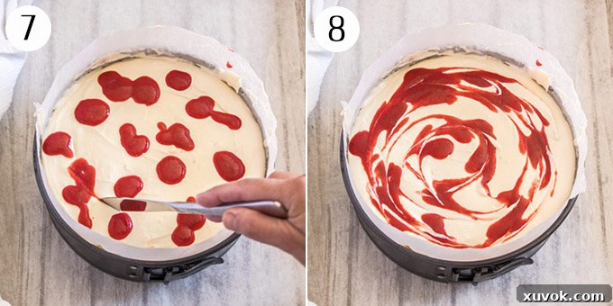 The artistic process of using a knife to gently create elegant swirls in the rich strawberry sauce atop the cheesecake, forming a beautiful marbleized pattern.