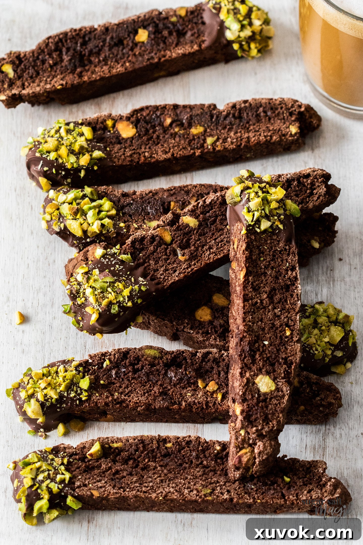 A row of 8 pieces of chocolate biscotti.