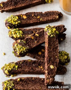 A row of 8 pieces of chocolate biscotti.