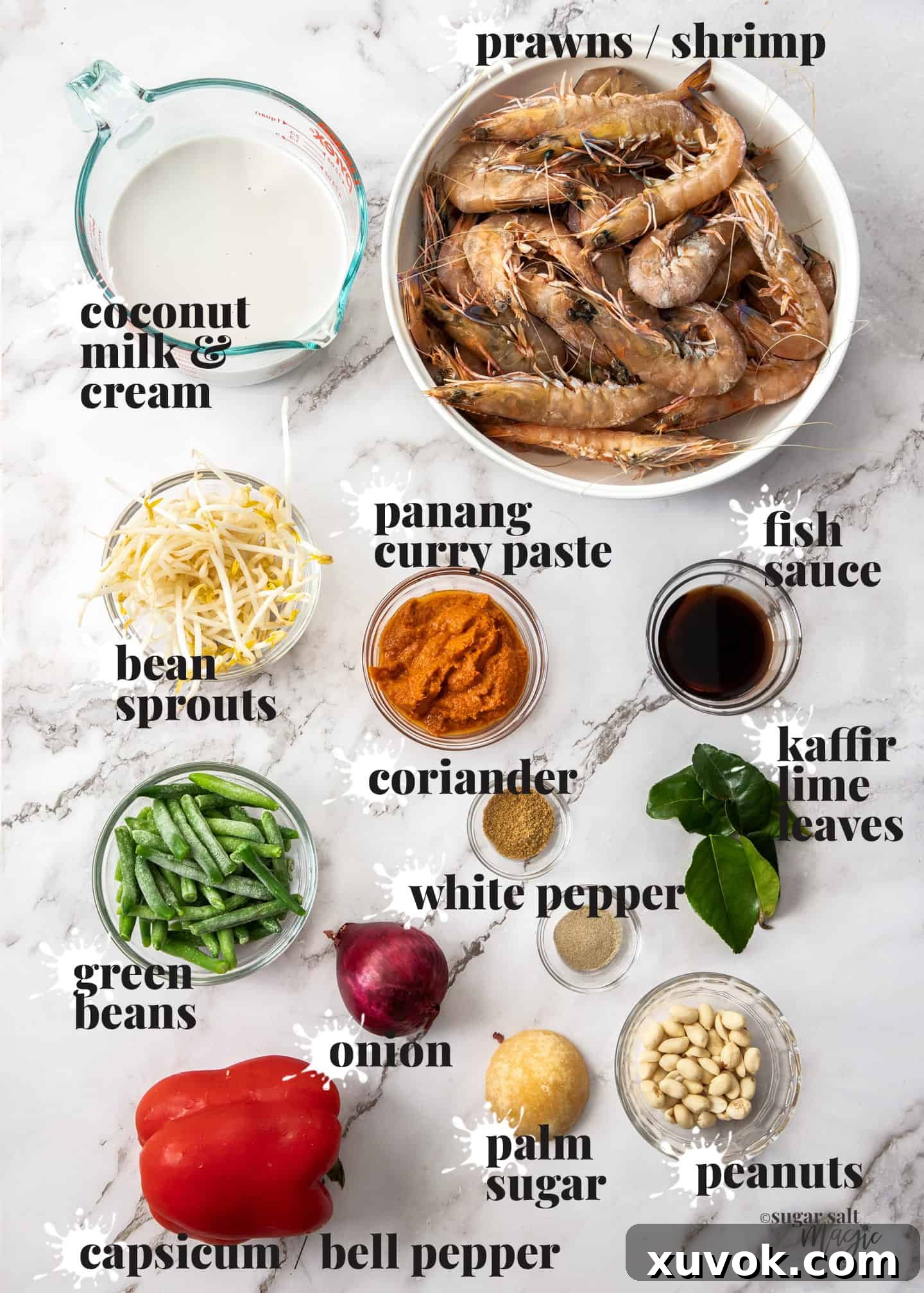 Ingredients for prawn panang curry laid out on a marble benchtop.