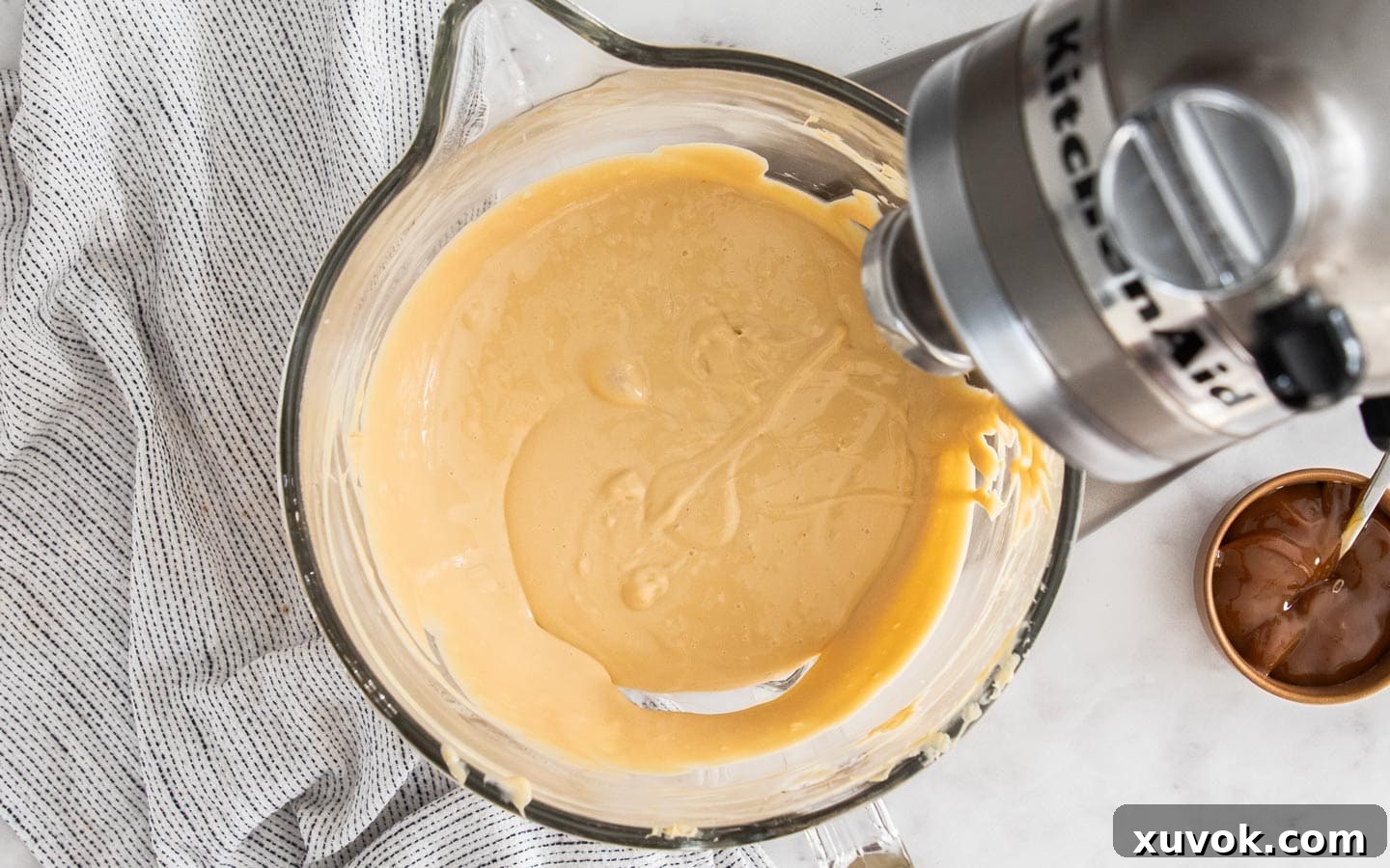 The cheesecake mixture, smooth and ready, before the addition of sour cream and vanilla, showing the perfect consistency.