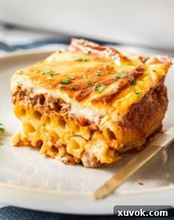 A slice of pastitsio on a plate, showcasing its layers.