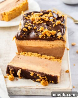 Front on view of the cheesecake with a slice cut in front.