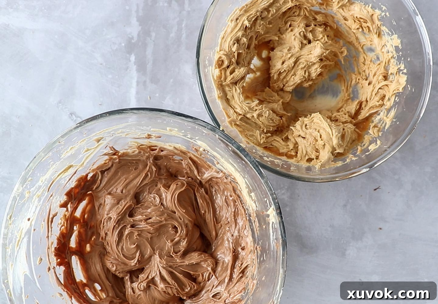 The chocolate and peanut butter mixtures in two separate bowls before folding in the cream.