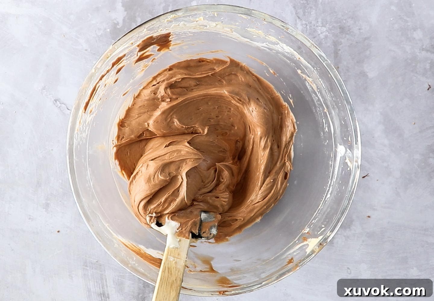 The chocolate cheesecake mixture in a mixing bowl.