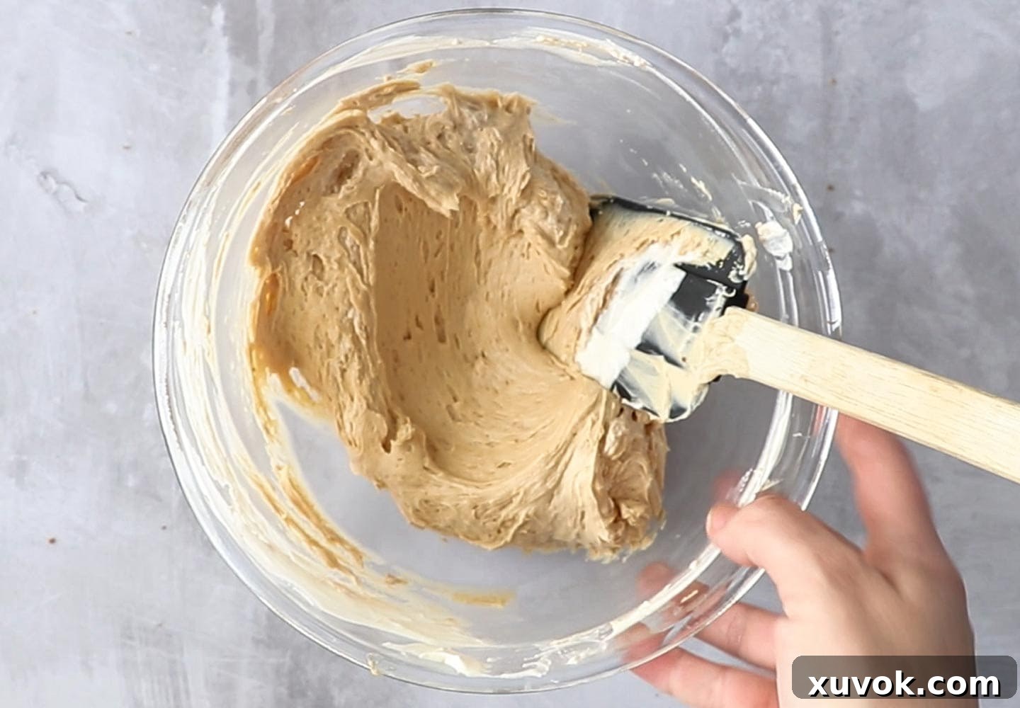 The peanut butter cheesecake mixture in a mixing bowl.