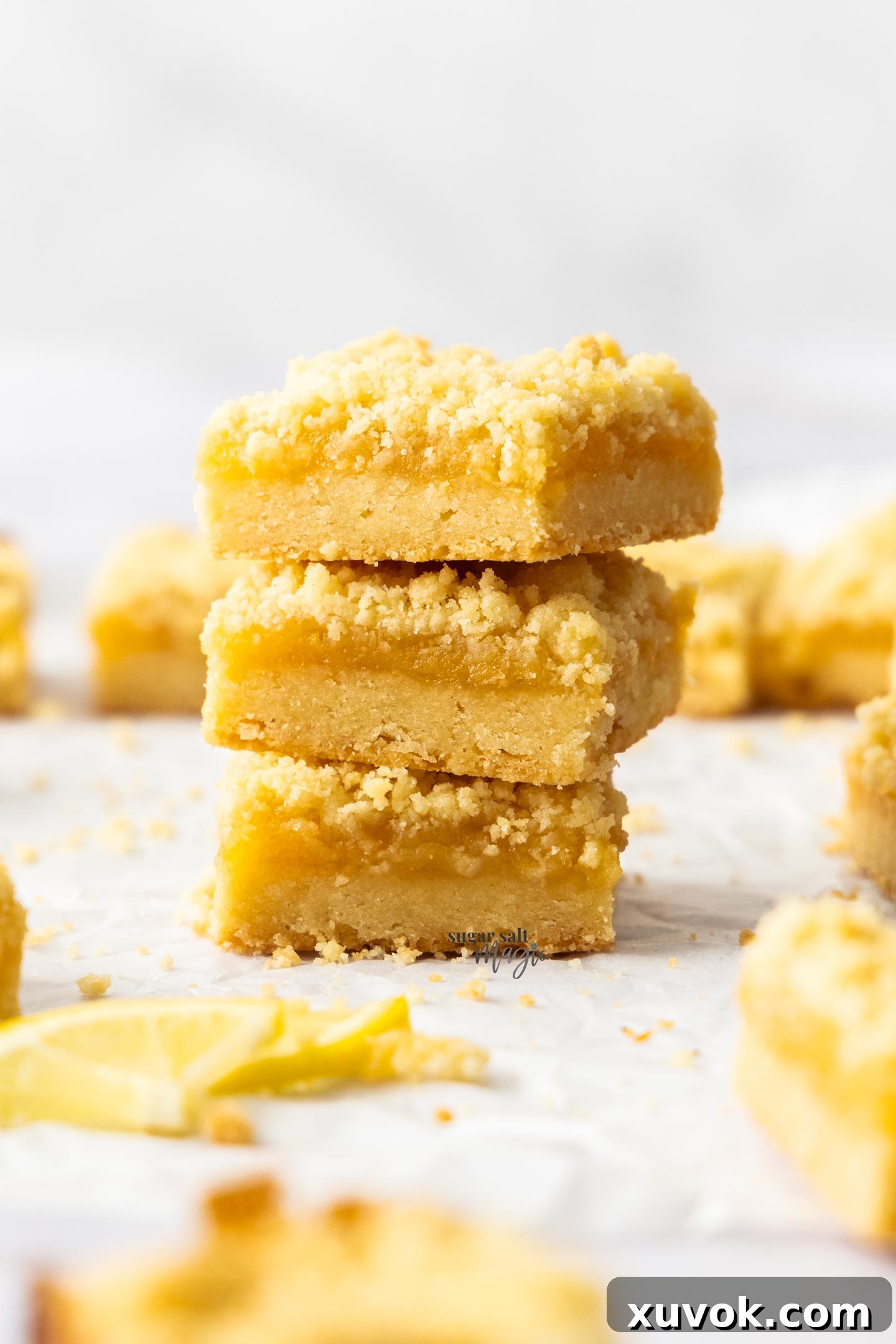 A stack of 3 lemon crumb bars.