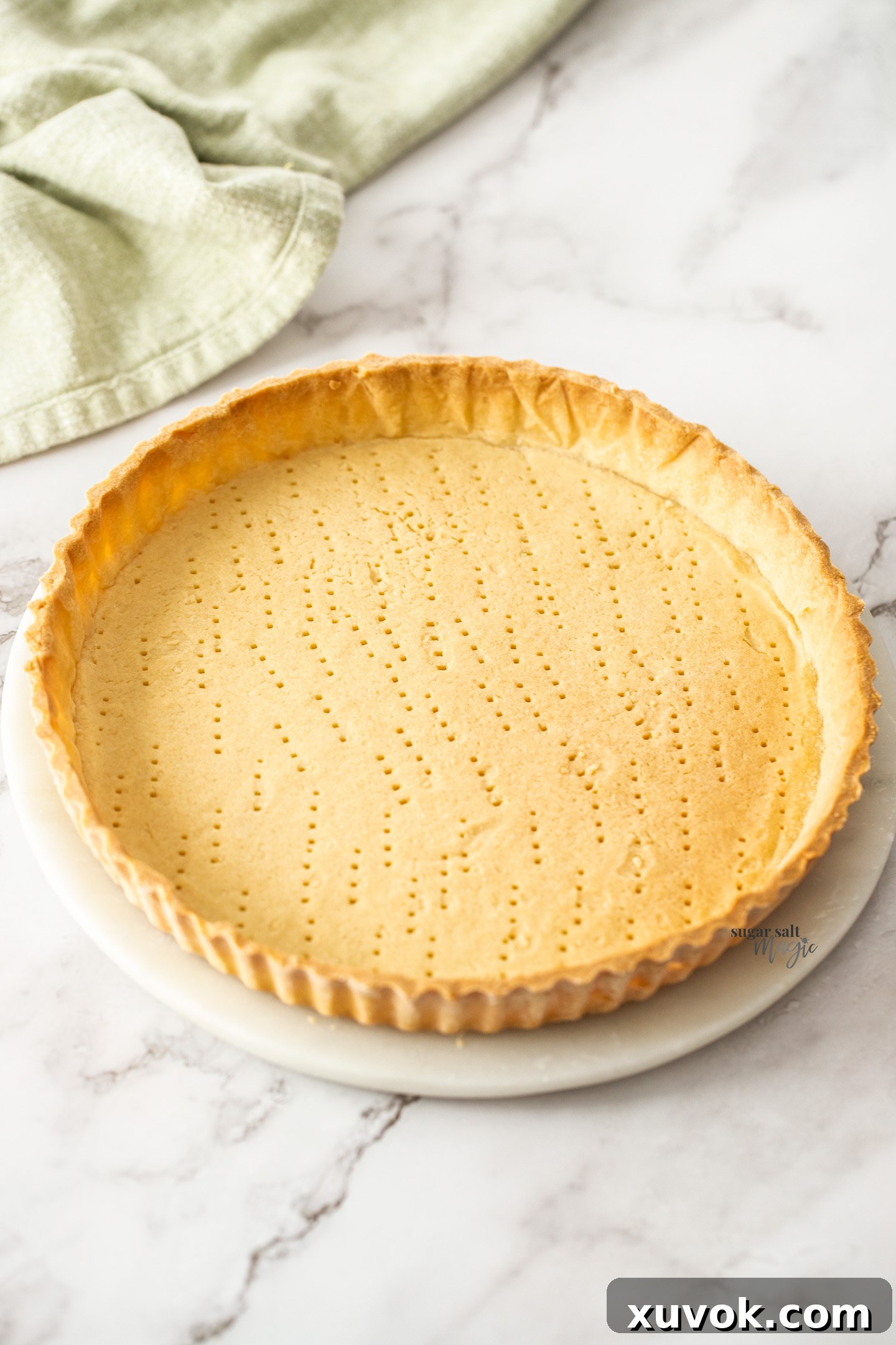 A beautifully baked sweet shortcrust pastry tart shell, perfectly golden and ready for filling.