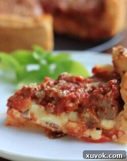 Deep Dish Pizza by Sugar Salt Magic - Chicago style Pizza Pie. A thick layer of mozzarella, pepperoni and sausage all topped off with a homemade pizza sauce