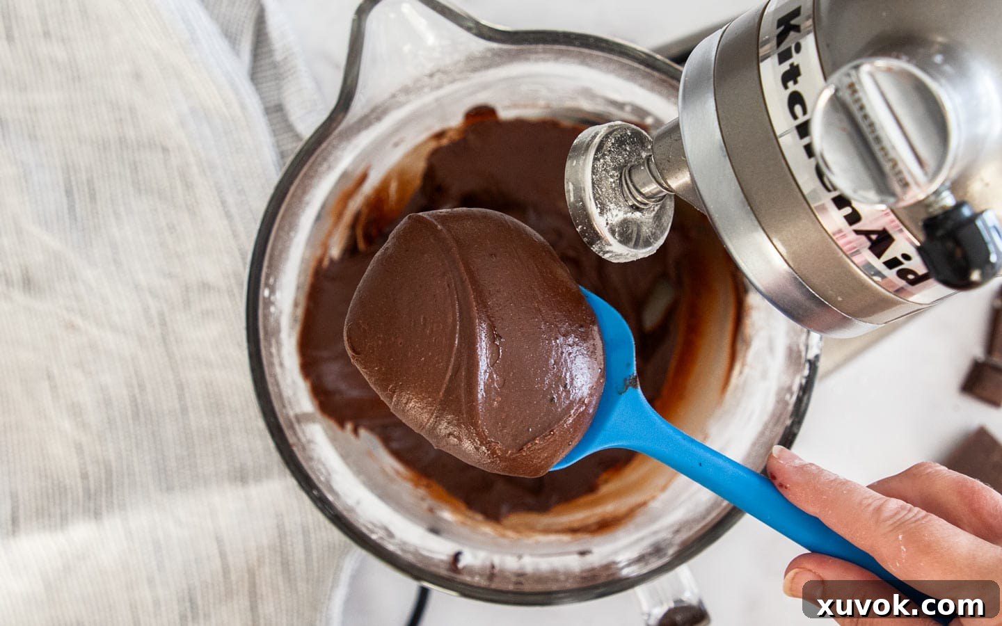 The freshly mixed chocolate fudge frosting, still soft before setting.