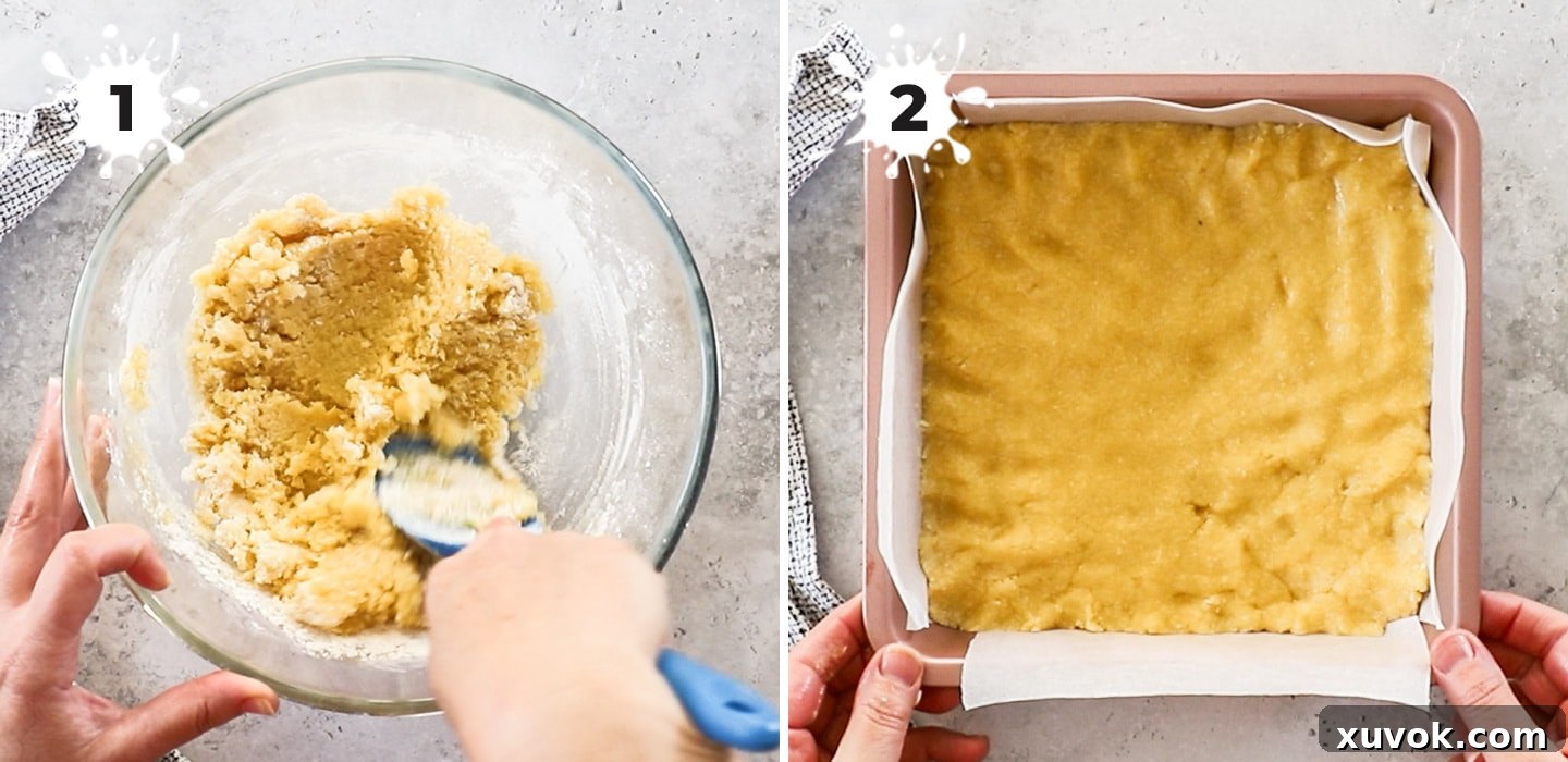 A bowl showing the shortbread mixture for the passionfruit slice being mixed with a spatula.