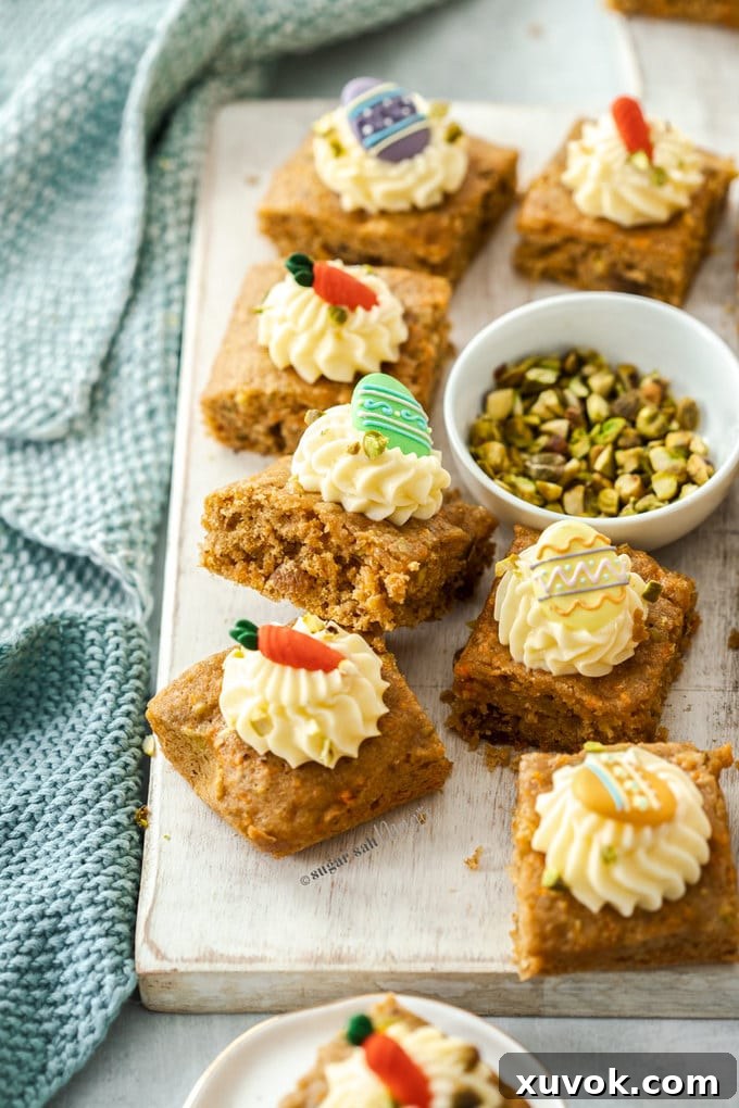 8 carrot cake bars and a small white bowl with pistachios