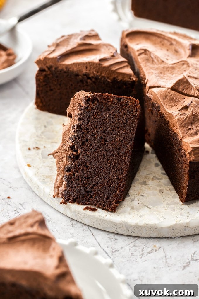 Slices of chocolate cake on a marble platter.