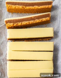 Top down view of 7 slices of peanut butter caramel slice.