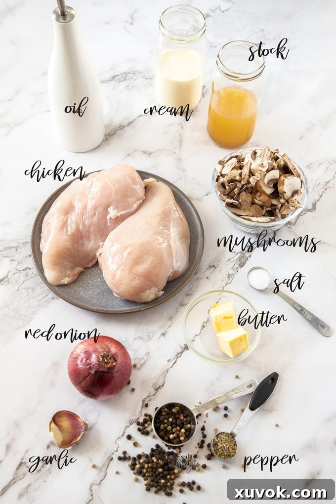Ingredients for peppercorn chicken laid out on a marble surface.