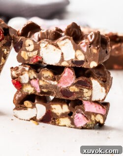 Three slices of rocky road stacked.