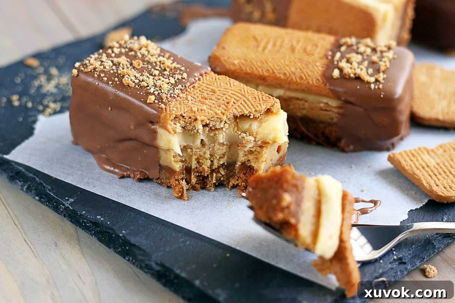 A Golden Gaytime Slice with a bite taken out, showcasing its creamy layers and crunchy topping.