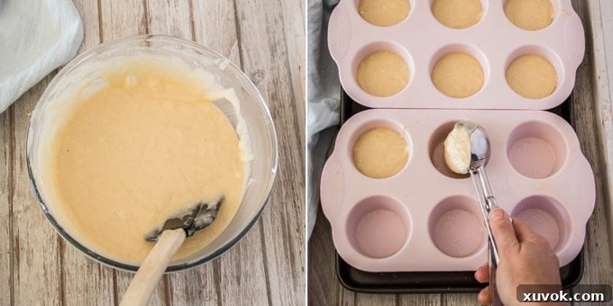 An ice cream scoop portioning out cupcake batter into a muffin tin.