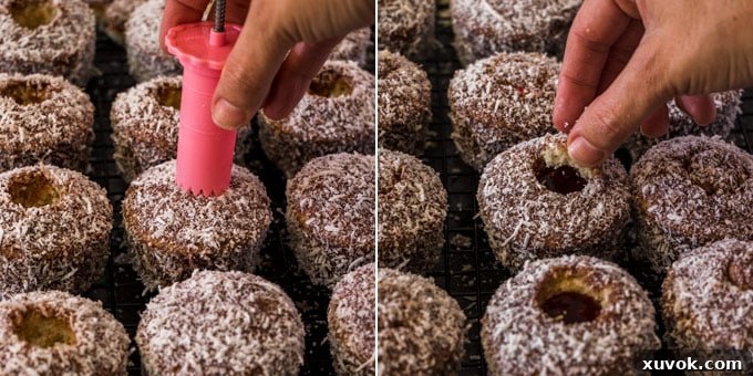 A hand using a cupcake corer to remove the center of a Lamington cupcake, ready for filling.