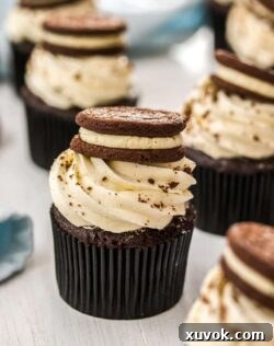 These Chocolate Cookies and Cream Cupcakes combine an easy cupcake recipe with a creamy, whipped frosting both inside and on top. These are a real chocolate vanilla treat.