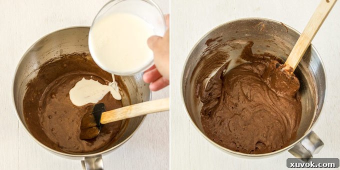 Buttermilk being poured into the chocolate cupcake batter, creating a smooth mixture.