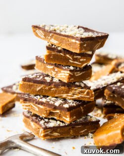 A delightful stack of golden almond buttercrunch toffee pieces, ready to be served.