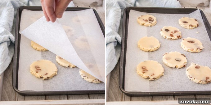 Showing the flattened cookies on a baking sheet, ready for the oven.