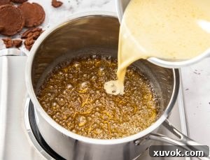 Cream being poured into hot bubbling caramel.