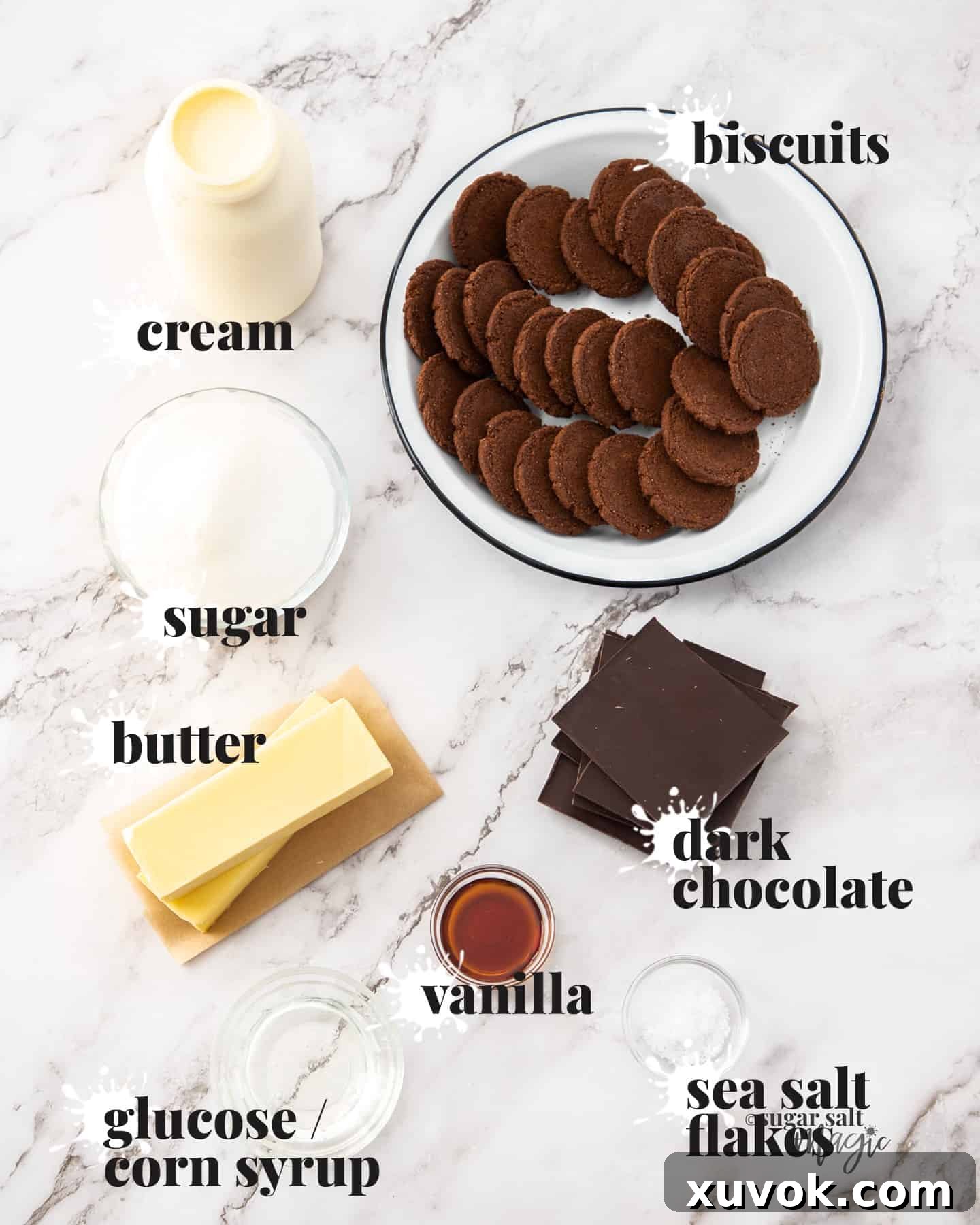 Ingredients for chocolate salted caramel tart on a marble benchtop.