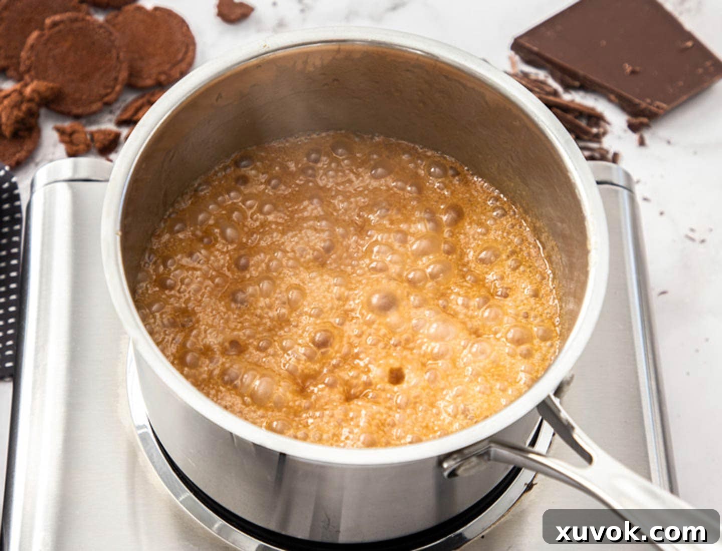 Bubbling caramel in a saucepan.
