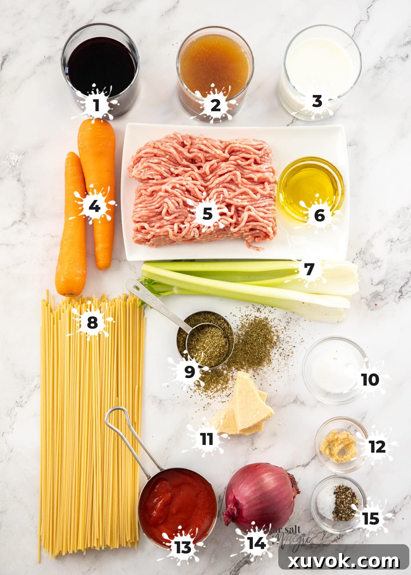 Ingredients for spaghetti bolognese on a marble worktop.